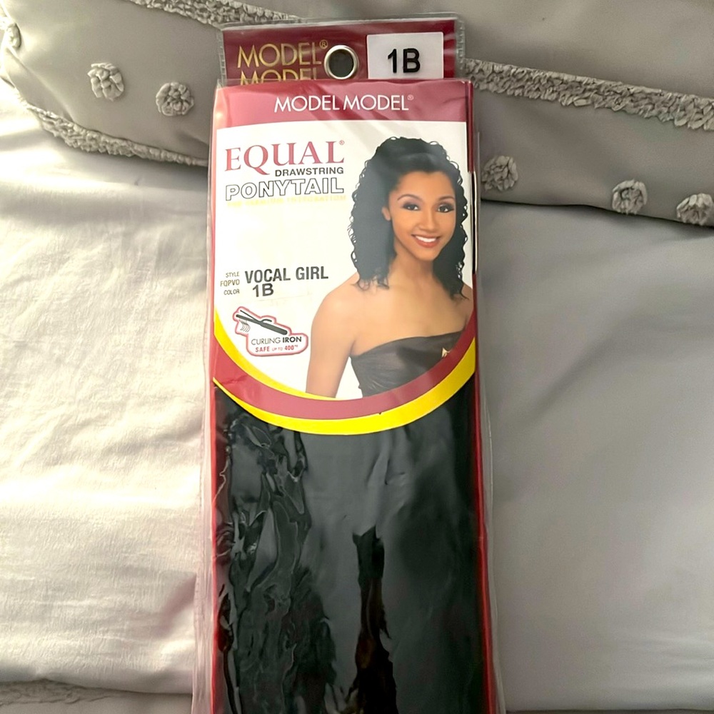 Curly ponytail with drawstring. Color is 1B. Never been used